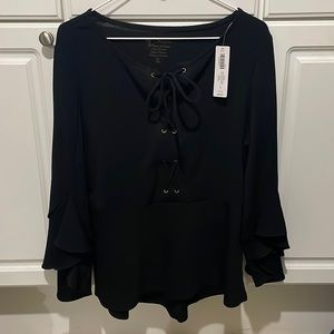 Womens size 2 tunic, Long sleeve ruffle at bottom of sleeve lace up front.